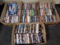 Four boxes containing a large quantity of assorted DVDs and Blu Rays