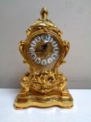A Swiss made Rococo style brass clock