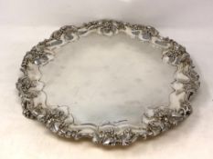 A good quality silver tray with scalloped edge decorated with vines & grapes, Sheffield 1910,