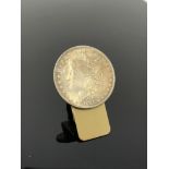 A money clip mounted with an American US dollar coin