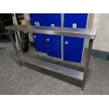 A narrow stainless steel two tier prep table,