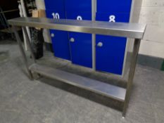 A narrow stainless steel two tier prep table,