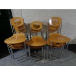 A set of eight contemporary beech and metal restaurant chairs