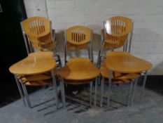 A set of eight contemporary beech and metal restaurant chairs