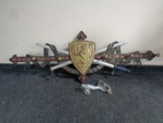 A cast iron Coat of Arms coat rack depicting a prancing lion on a shield