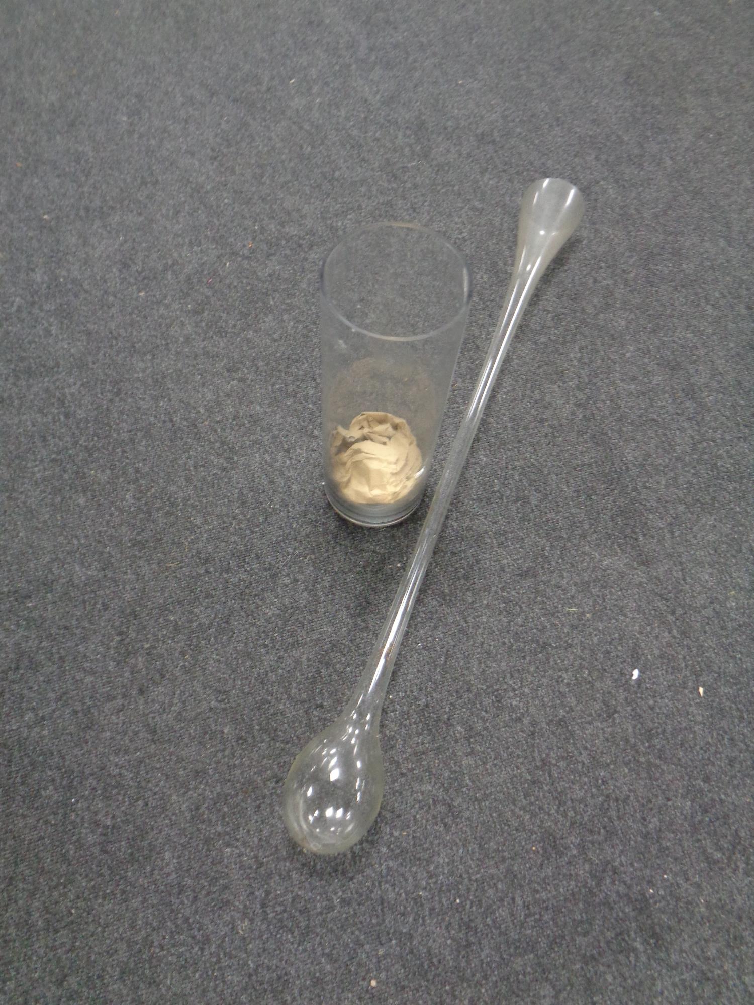 A glass yard of ale together with a glass vase
