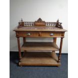 A 19th century oak marble topped three tier serving stand with gallery