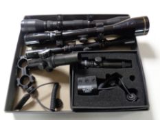 A box containing a boxed laser scope together with four further air rifle scopes