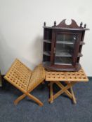 A wall mounted curio cabinet together with a teak lattice magazine rack and folding occasional