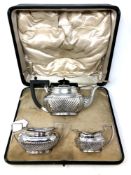 A silver three piece bachelor's tea service, James Dixon and Son, Sheffield 1894, 644.3g, boxed.