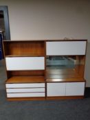 A pair of mid 20th century teak and white melamine bureau display units fitted shelves and
