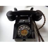 A black Bakelite cased telephone