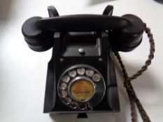 A black Bakelite cased telephone