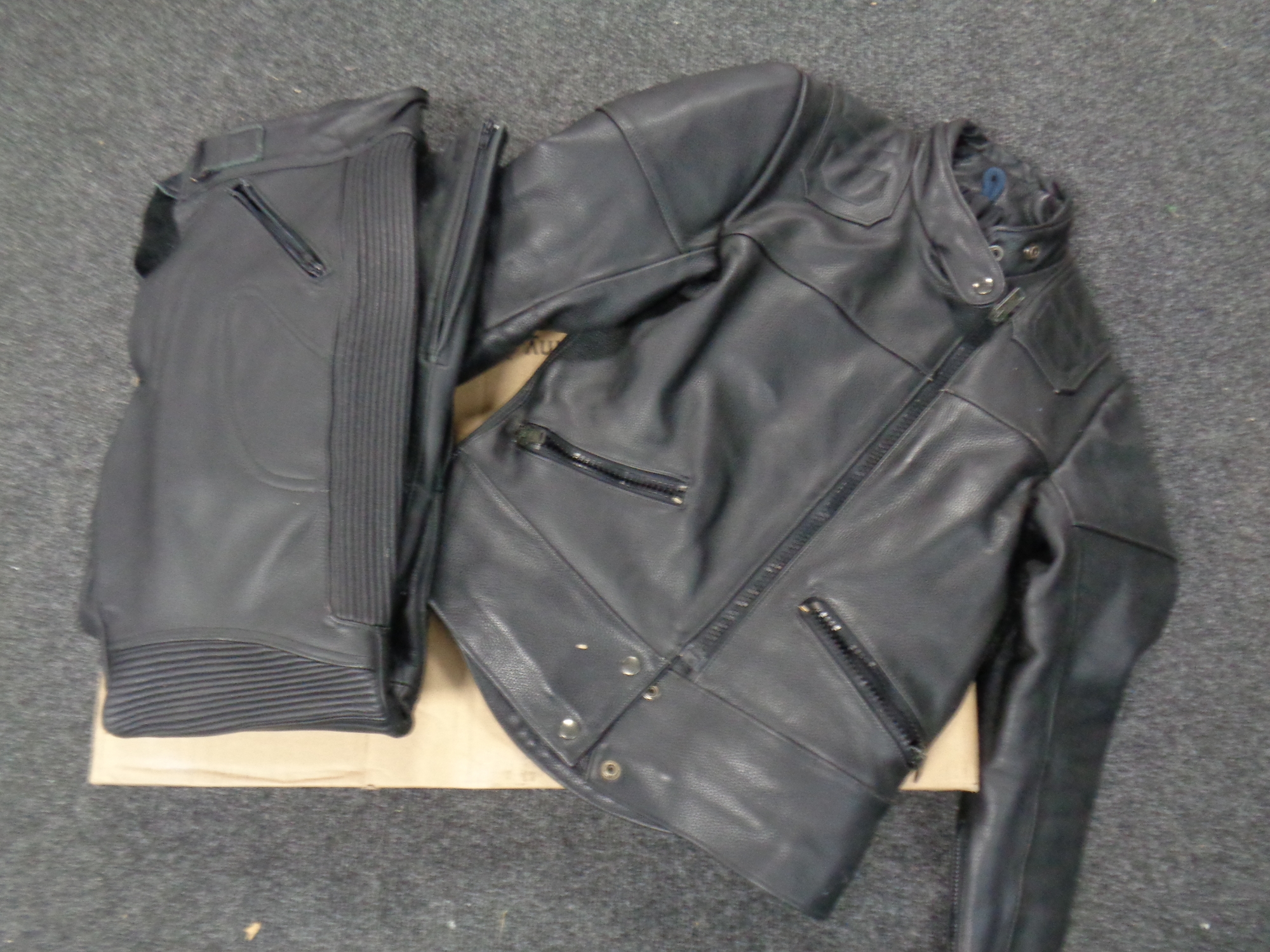 A vintage lady's 'TT' leather motorcycle jacket, size 10, together with leather motorcycle trousers,