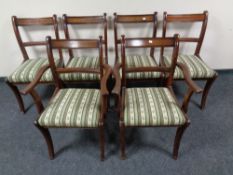 A set of six Regency style inlaid mahogany dining chairs comprising of two carvers and four singles