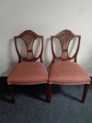 A pair of mahogany shield back dining chairs