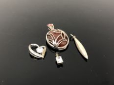 Four silver pendants