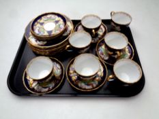 A tray containing 19 pieces of 19th century Copeland Spode gilt rimmed peacock patterned china