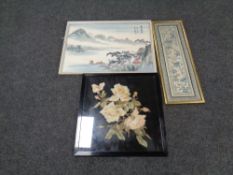 A framed floral needlework panel together with a framed Japanese silk work panel and a further