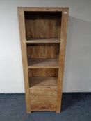 A set of mango wood open bookshelves fitted three drawers beneath (as found)