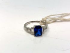 A sterling silver Art Deco style ring set with a blue stone,