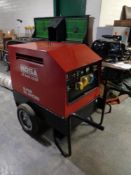 A Mosa GE 6000 SX-GS super silenced portable site generator with key