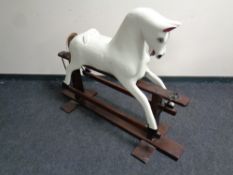 A wooden rocking horse on stand (as found)