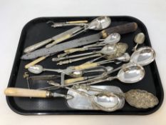 A tray of assorted EPNS including cutlery, nut crackers,