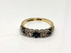 An antique five stone sapphire and diamond ring, size O. CONDITION REPORT: 3.