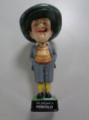 A cast iron figure - Penfold golfer