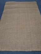A contemporary Hessian rug 242 cm x 175 cm