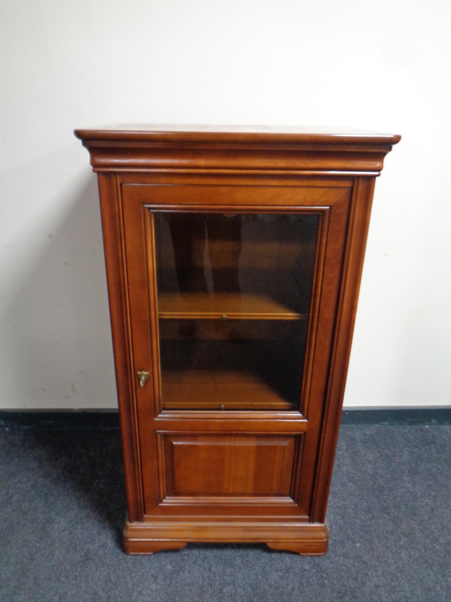 An audio cabinet in a mahogany finish