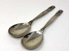 A pair of Georg Jensen acorn pattern spoons, length 15 cm.