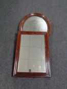 An antique oval mahogany framed mirror together with a further framed mirror