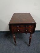 A William IV mahogany flap sided work table fitted two drawers