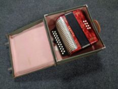 A case containing Hohner Erica accordion together with a further Hohner mouth organ
