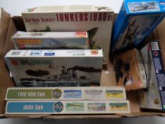 A box containing eight plastic modelling kits to include Airfix and Matchbox naval boats and