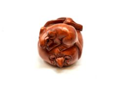 A carved Chinese wooden netsuke,