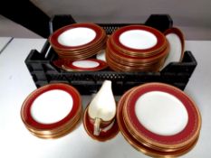 A quantity of antique Minton red and gilt dinnerware