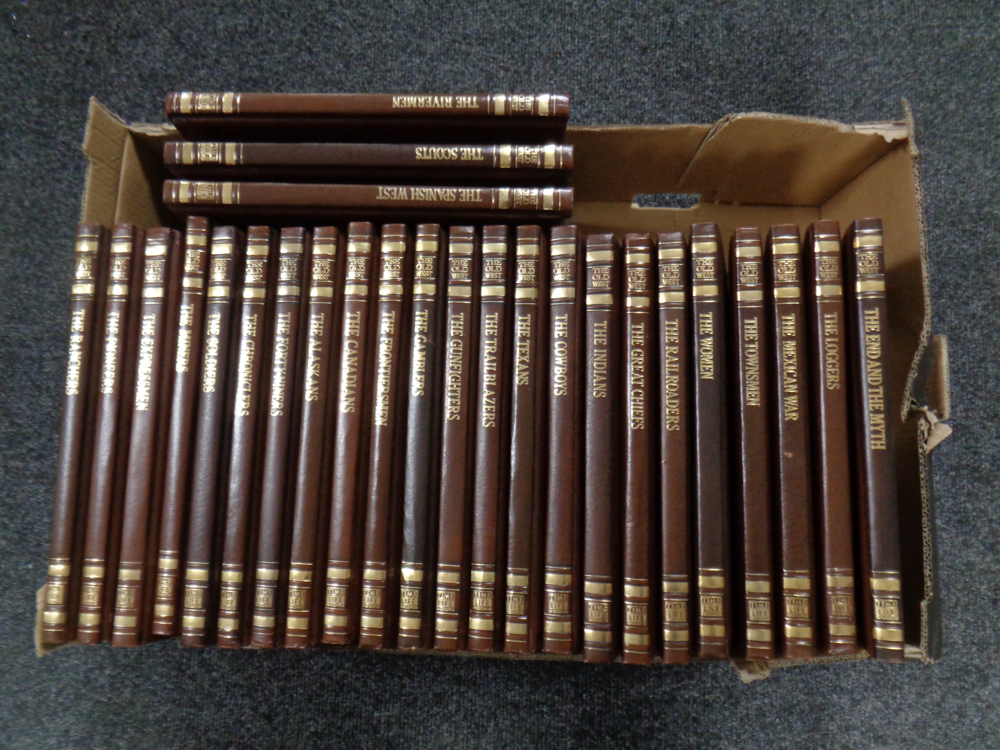 A box containing 26 Time Life volumes,