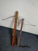 Two wooden crossbows (one as found)