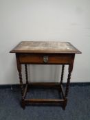 A late Edwardian oak barley twist occasional table fitted a drawer