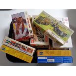 A tray containing 12 assorted Revell and Airfix plastic modelling kits, historic cars,