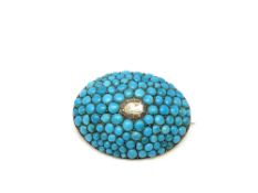 An antique turquoise and diamond brooch.