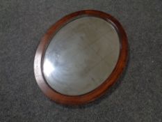 An Edwardian oval framed bevel edged mirror