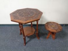 An Edwardian octagonal carved two tier occasional table together with a further carved eastern wine