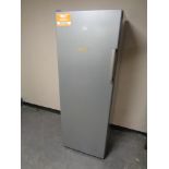 An Indesit upright freezer