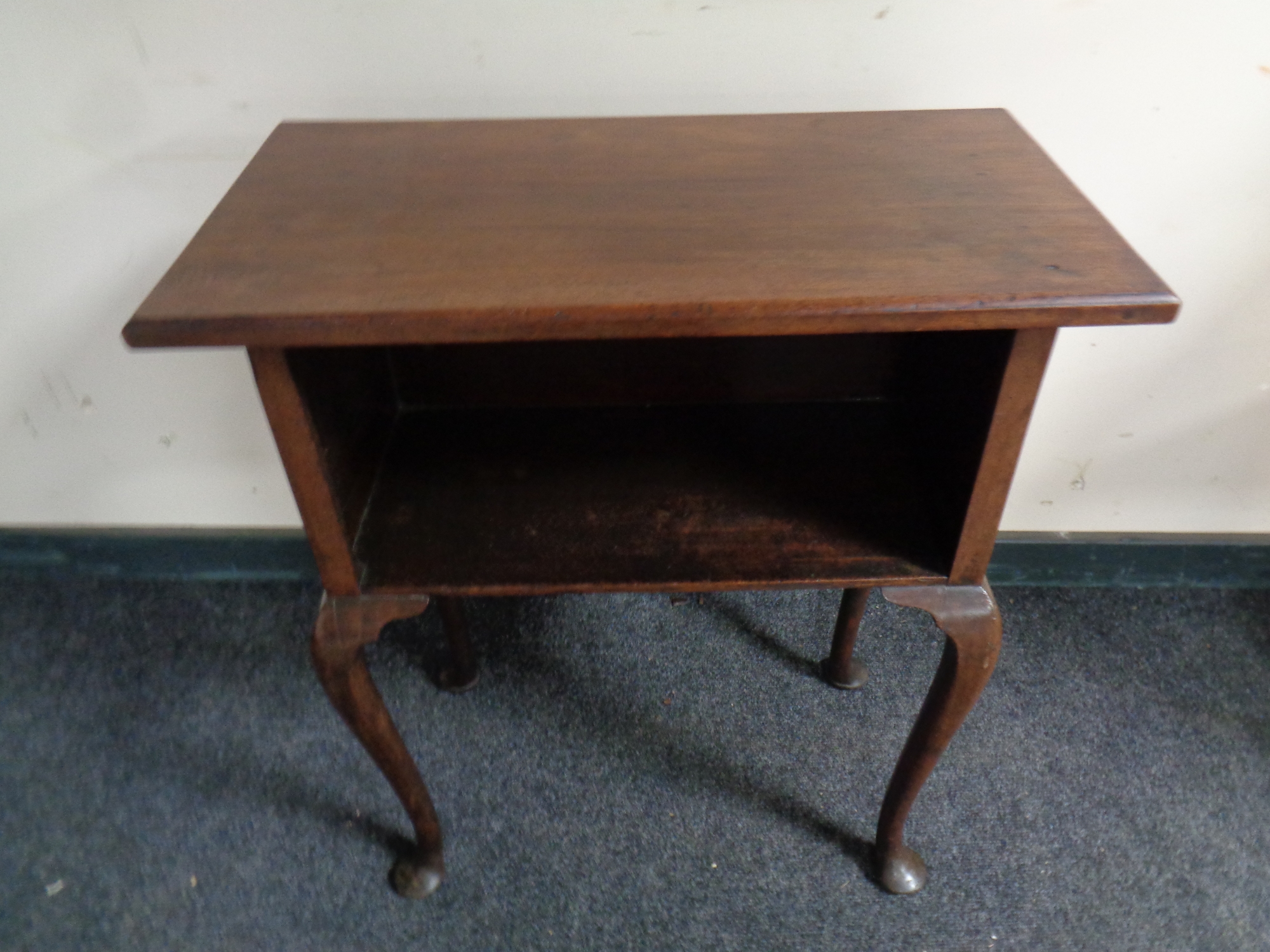 A 19th century mahogany flap sided cabinet on raised Queen Anne legs