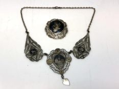 A silver niello Persian necklace and brooch.