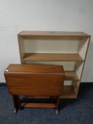 A set of teak effect open bookshelves together with a drop leaf table